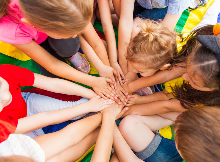 Large kids family together in a circle